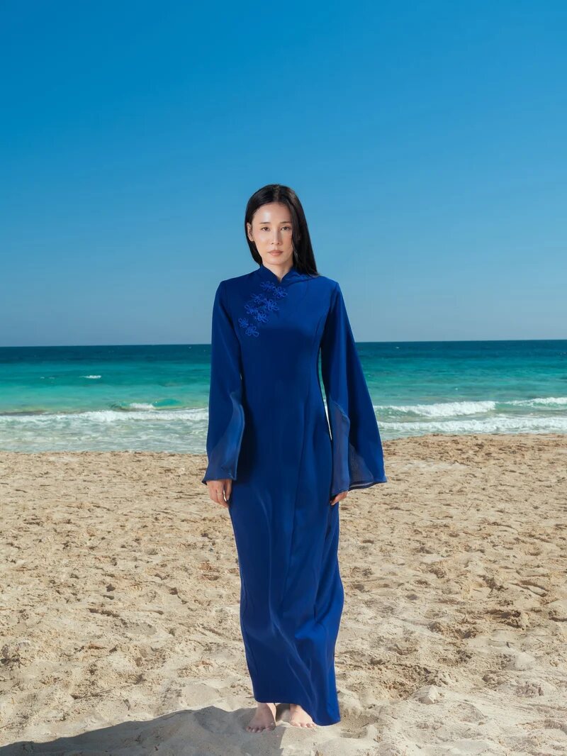 The Maxi Qipao in midnight blue on the beach